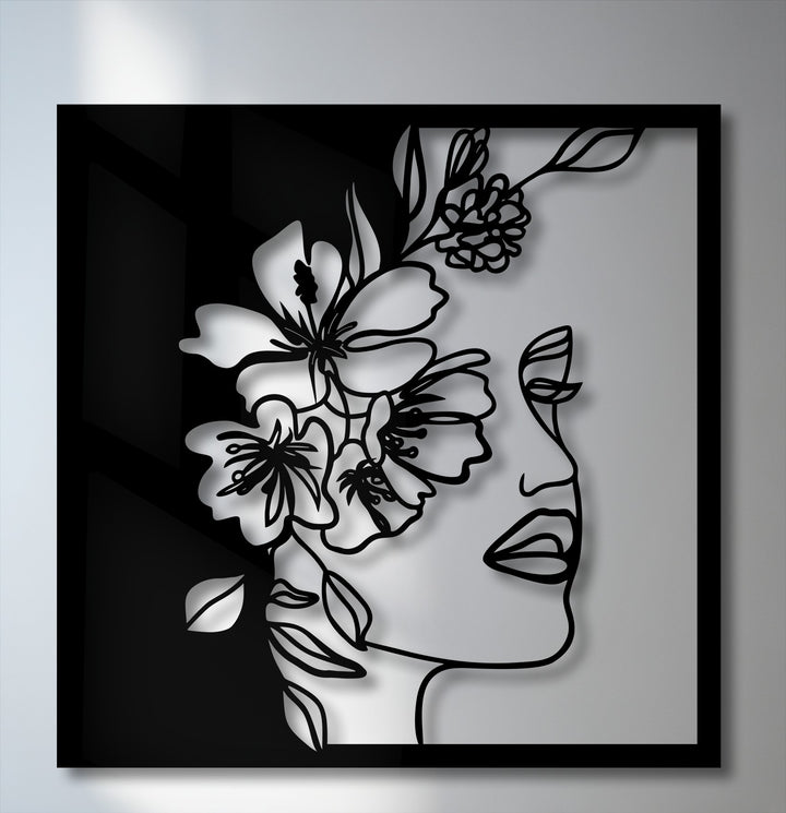 The serene mood of this unique metal wall art features an elegant floral woman line art with a minimalist design.