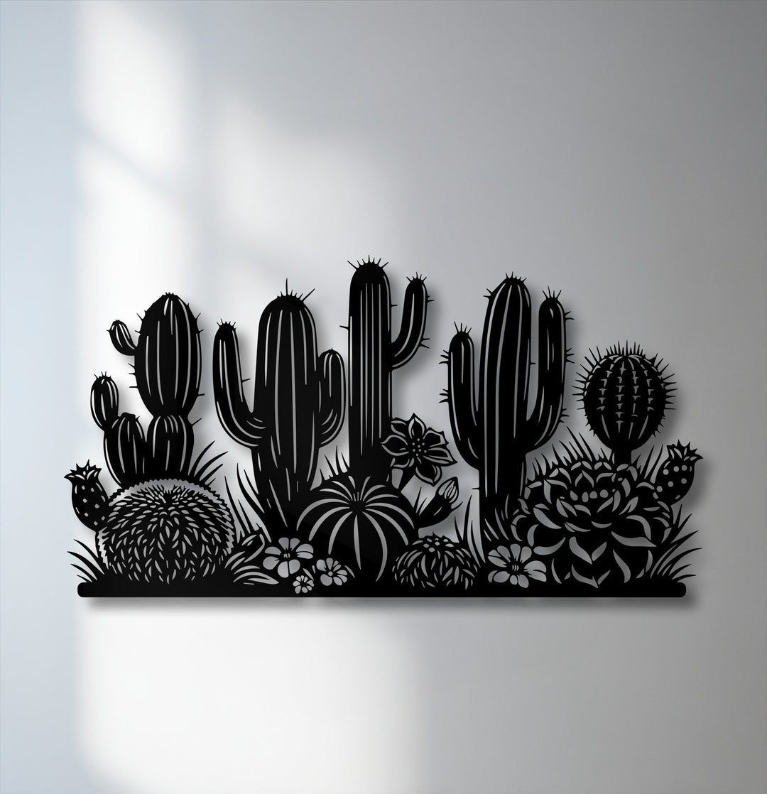 Foreground detail highlights a round cactus, succulents, and small flowers, forming a decorative metal art desert silhouette.