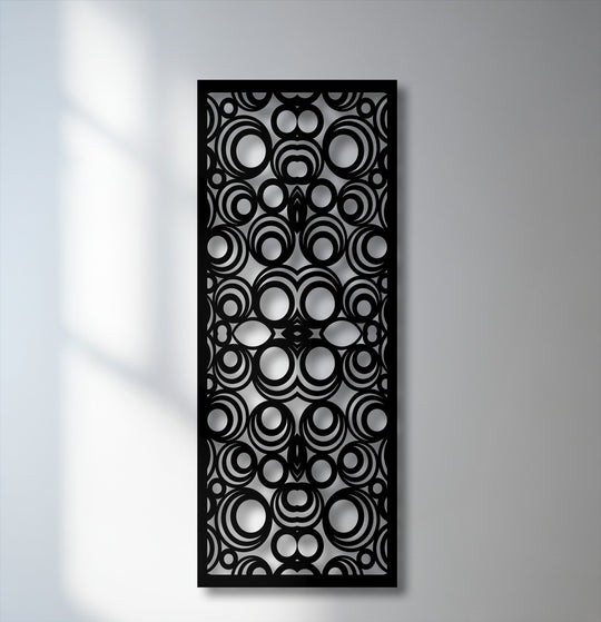 Light softly casting ethereal shadows on the left wall subtly enhances the geometric circle pattern metal art for wall.