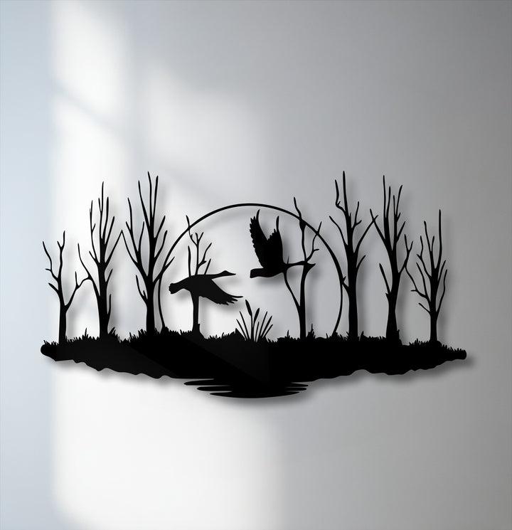 The background features a softly lit light gray wall, creating a subtle contrast for the elegant forest birds metal wall decor.
