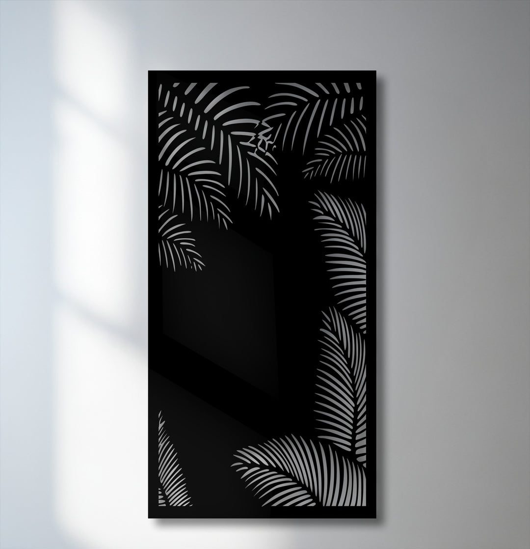 The striking color contrast in this metal wall decor highlights bold, light gray tropical palm silhouettes against a deep black background.