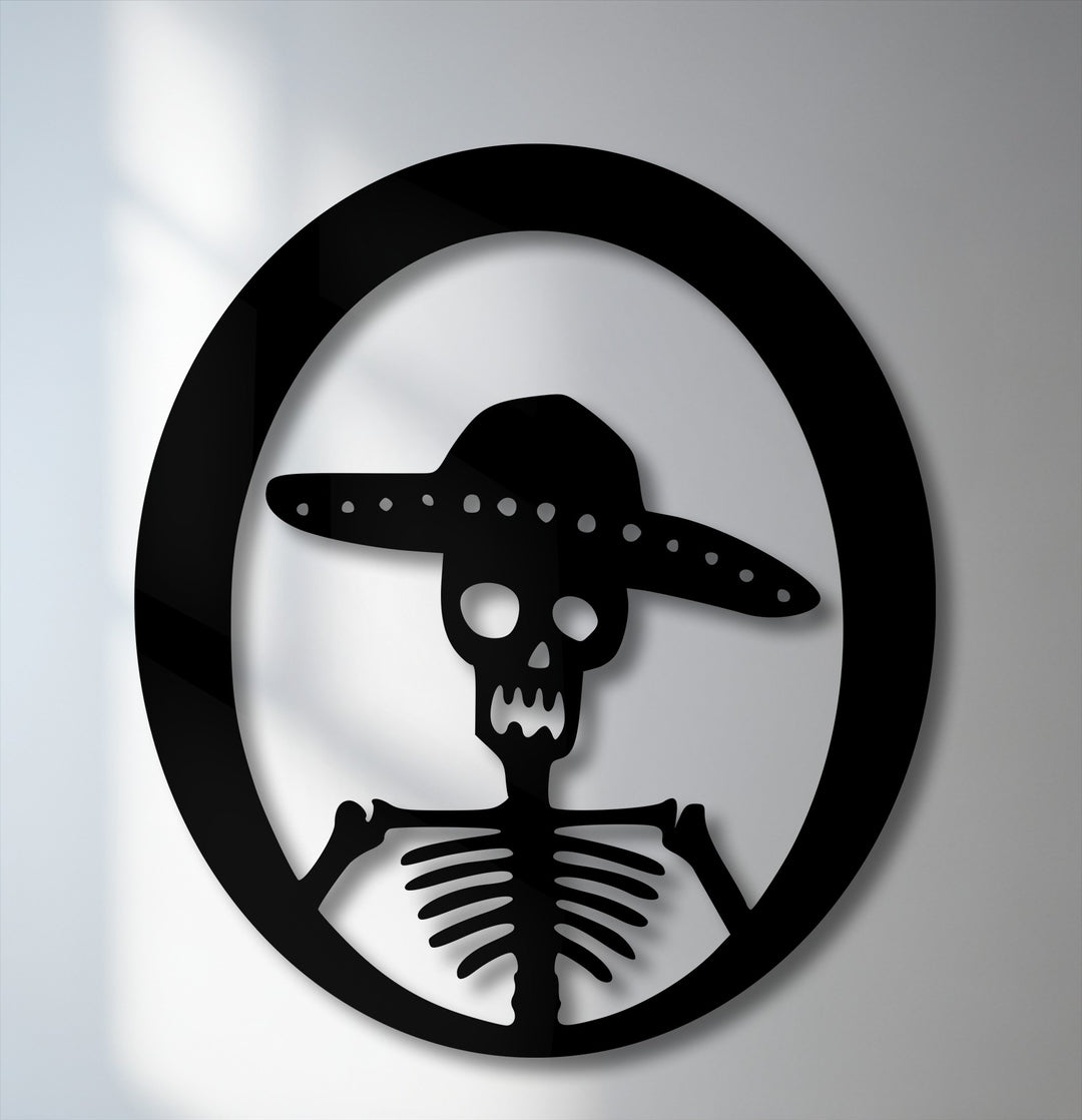 A striking Sombrero Skeleton unique metal wall art piece, featuring a bold black silhouette of a skeleton wearing a sombrero in a circular design.