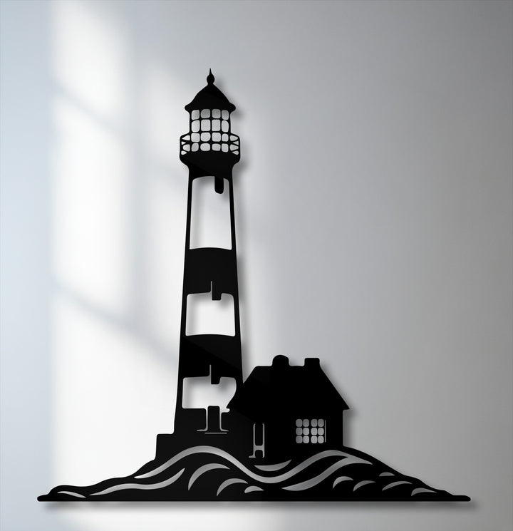 Realistic details define this intricate metal wall decor, depicting a coastal lighthouse, house, and ocean waves as a striking silhouette.