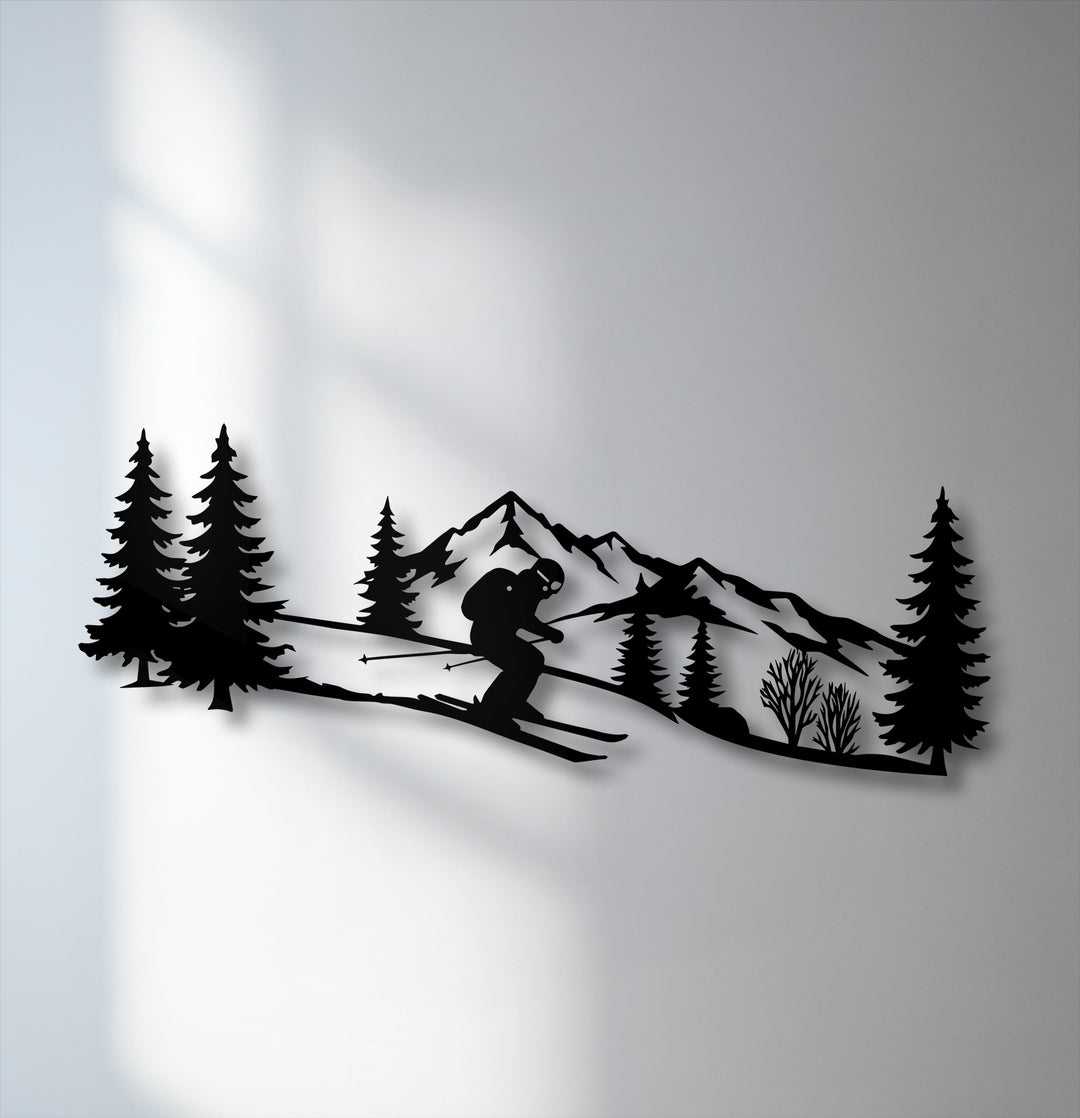 Negative space on the bright wall starkly contrasts the intricate black metal wall decor, showcasing an alpine skier mountain scene.