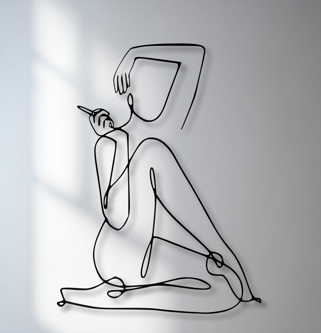 The stillness of the elegant abstract figure in this minimalist female line art metal decoration wall art emanates a serene calm.