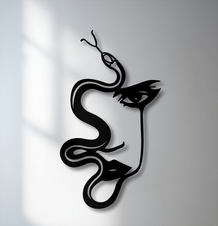 The distinct, crisp edges of the black abstract woman and serpent silhouette form a modern metal decoration wall art, casting a subtle shadow.