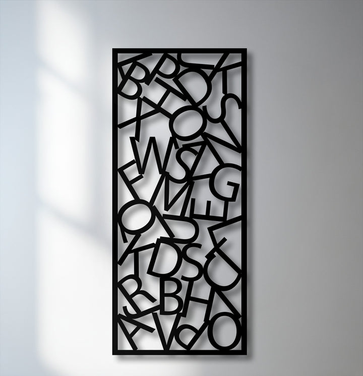The unique metal wall art exhibits a smooth, matte surface texture highlighting a captivating abstract letter composition.