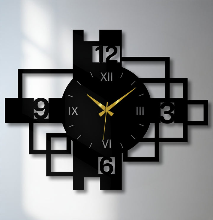 Black geometric metal wall clock edges intersect with square frame borders, creating decoration wall art featuring roman numerals and gold hands.
