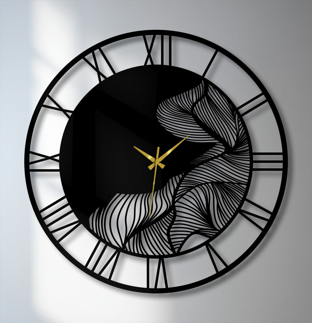 Finely crafted metal wall decor featuring an abstract leaf design, Roman numerals, and gold hands showcase exceptional material quality in this modern wall clock.