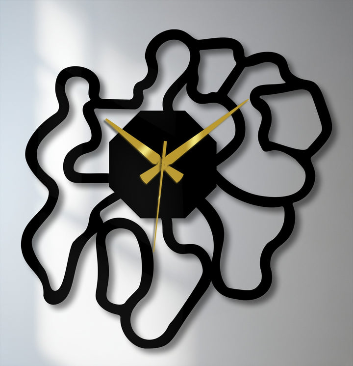 Smooth metal artwork shapes of this modern abstract metal wall clock create a distinct textural contrast, enhancing its contemporary design.