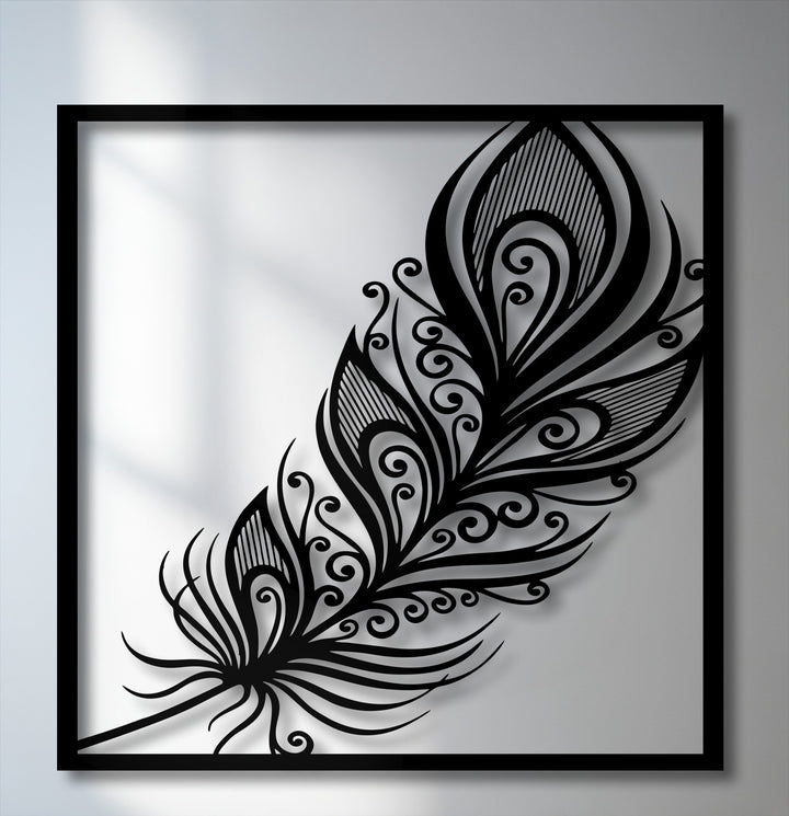 The darkest area reveals the elegant black ornate feather metal wall art, an exquisite example of decorative metal art with delicate swirls.