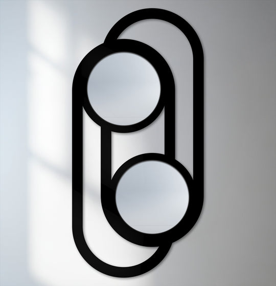 Subtle shadows and soft gradients on the wall behind this modern minimalist double circle link decoration wall art mirror enhance its elegance.