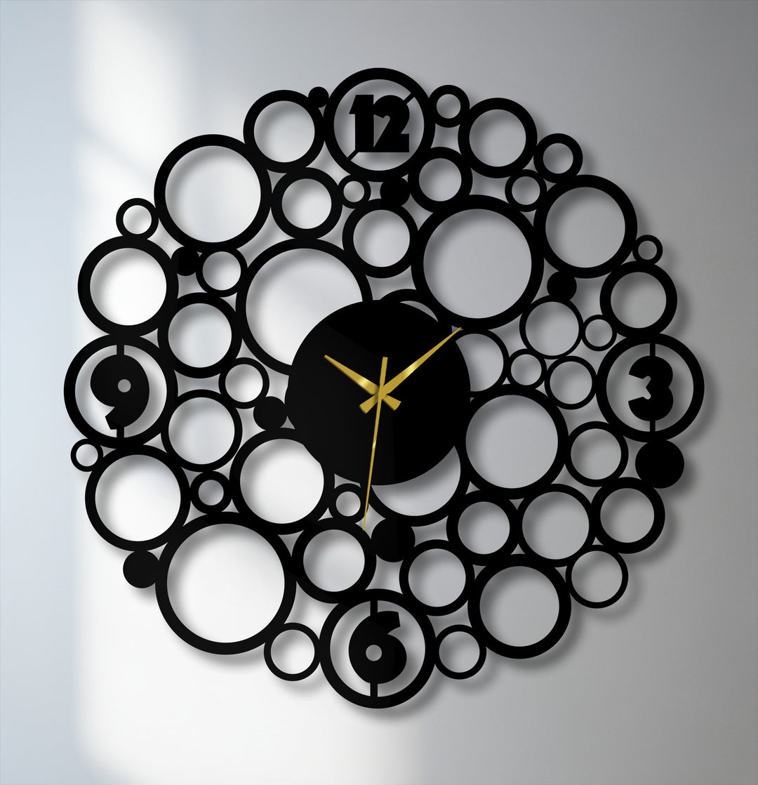 Softest shadows accentuate the abstract circle design of this bubble metal wall clock, adding a touch of modern home decoration to the scene.