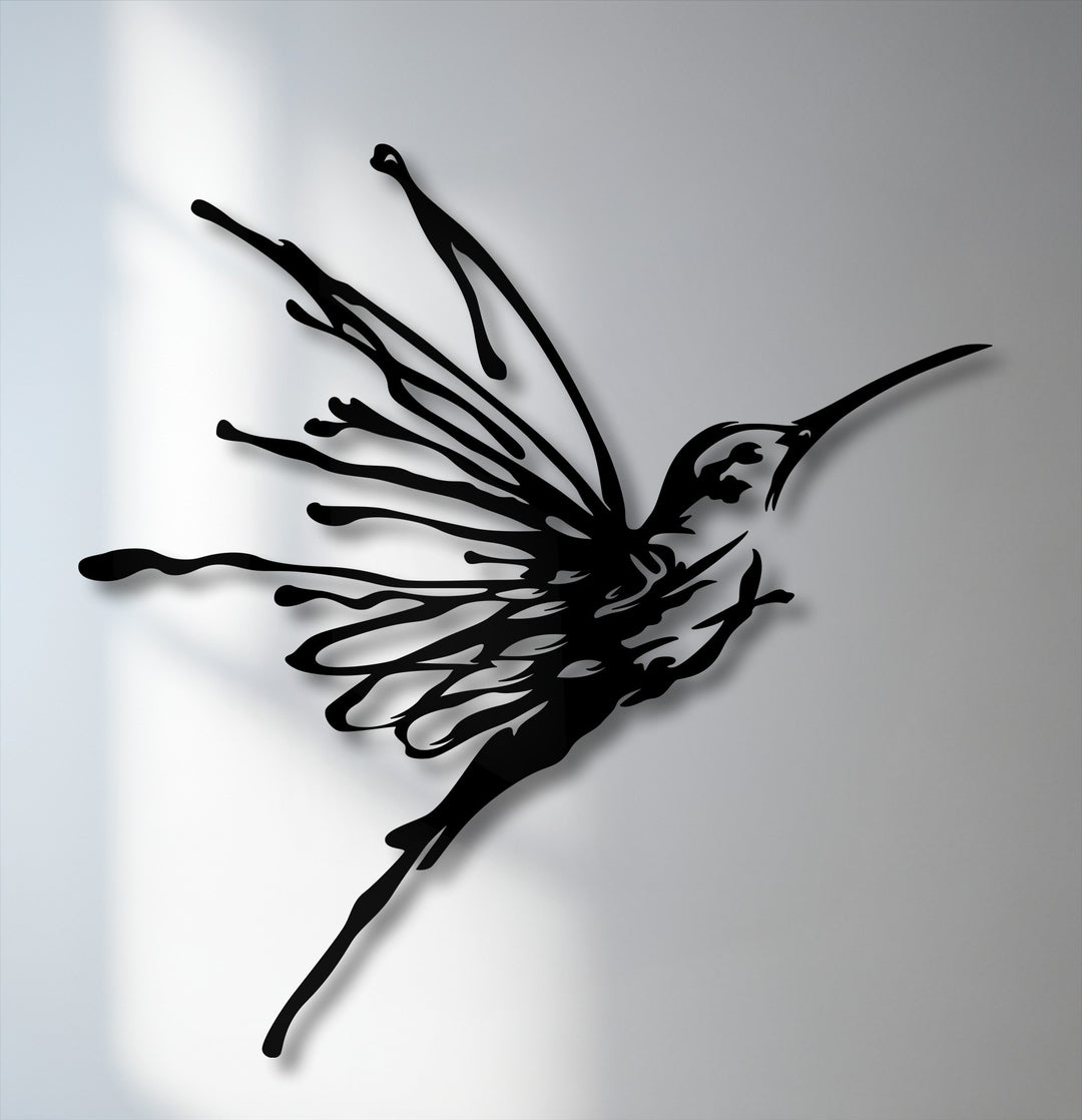 The crisp, flowing edges and defined borders of the flying hummingbird metal art showcase its elegant design as unique metal wall art.
