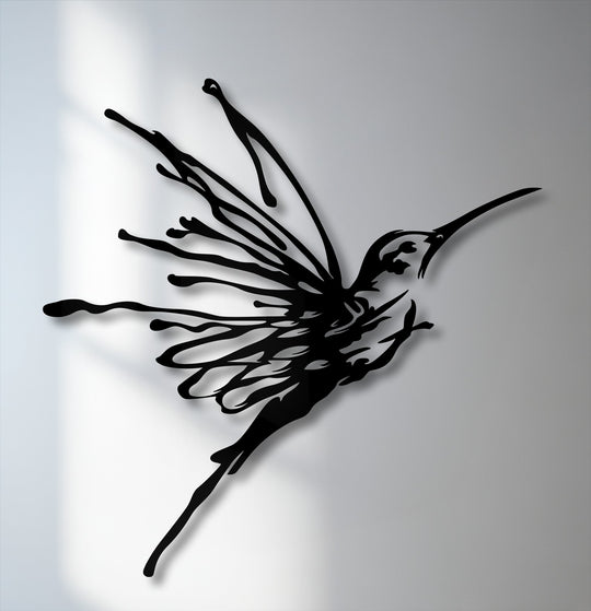 The crisp, flowing edges and defined borders of the flying hummingbird metal art showcase its elegant design as unique metal wall art.