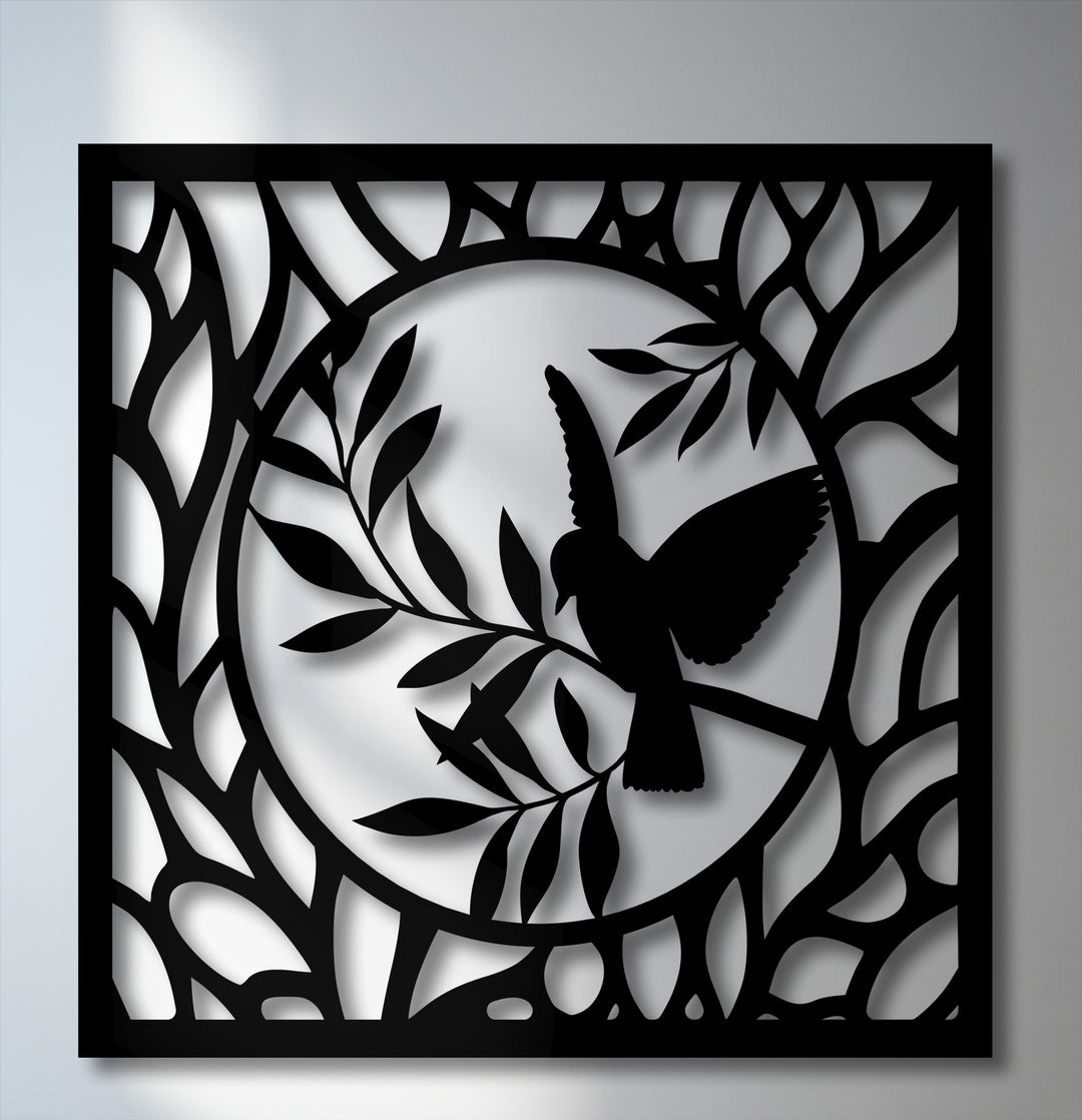 The foreground showcases an elegant, intricate decorative metal art panel featuring a graceful bird perched on a branch within a circular nature design.
