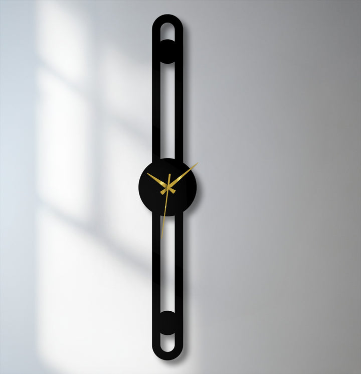 Negative space defines the slim lines of this minimalist vertical metal wall clock, a unique example of metal wall decor creating depth and interest.