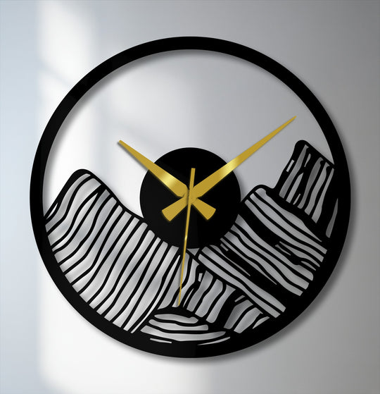 Finished in sleek black, this modern canyon landscape metal wall clock offers a striking silhouette effect as a unique metal wall art piece.