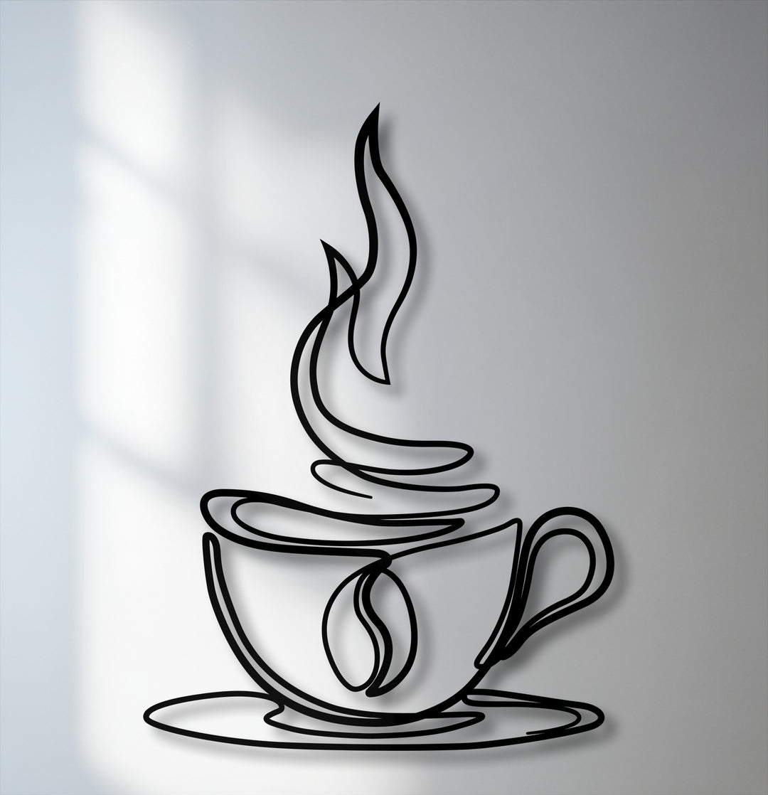 The stark black lines of the minimalist coffee cup metal wall decor create a crisp color contrast against the light grey background with subtle shadows.