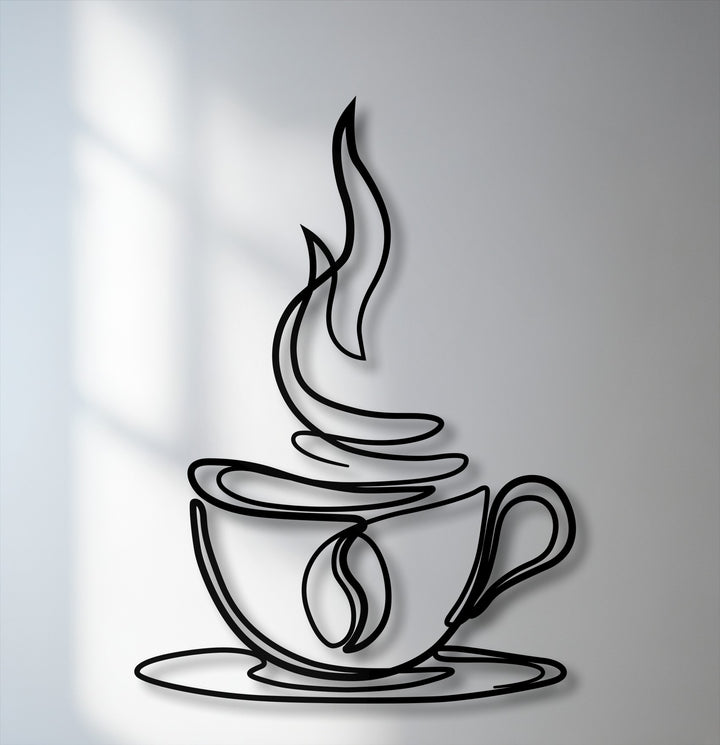 The stark black lines of the minimalist coffee cup metal wall decor create a crisp color contrast against the light grey background with subtle shadows.