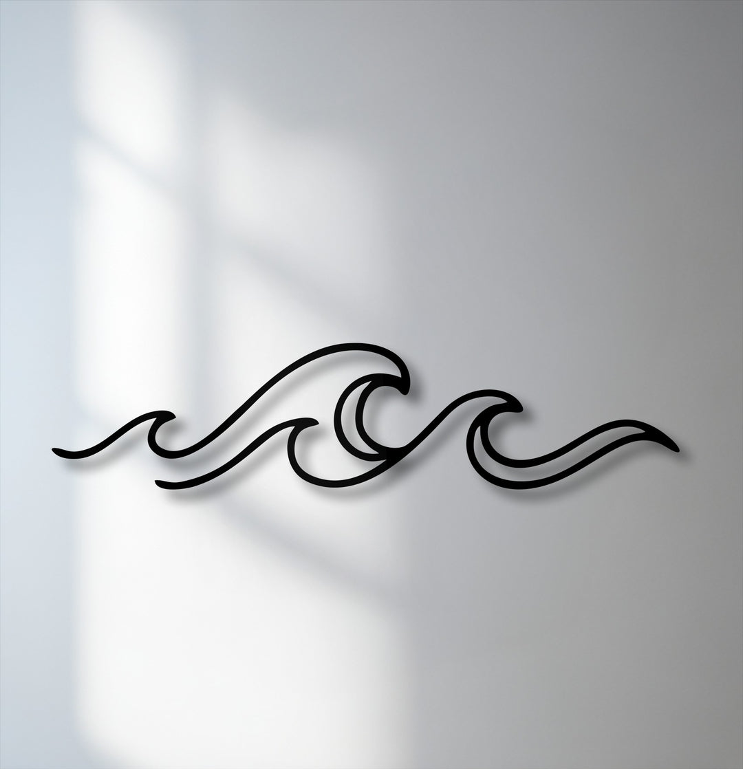 Gentle, diffused shadows softly blend with the minimalist ocean wave line decorative metal art, creating a serene ambiance on the wall.
