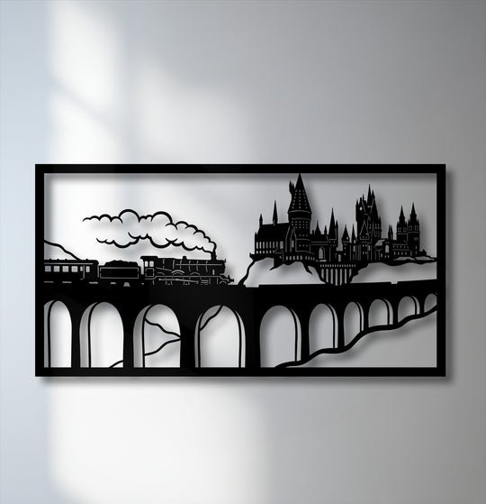 Strong shadows cast by the intricate Wizard Castle Train Scene decorative metal art panel create a dramatic contrast on the sunlit wall.