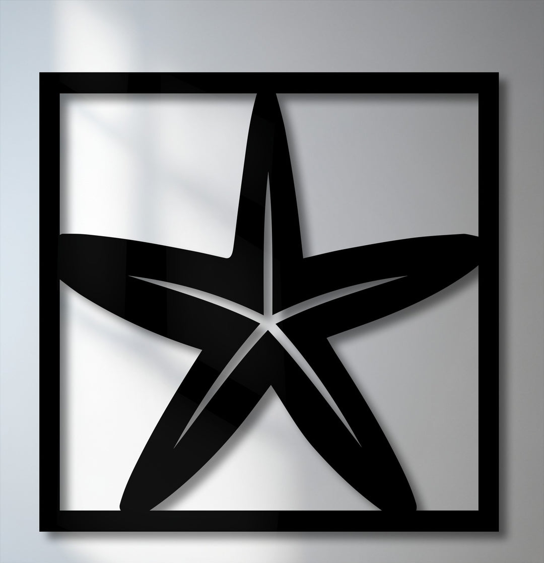 The prominent focal point of this unique metal wall art is a sleek black starfish framed elegantly on a bright, subtly lit background.