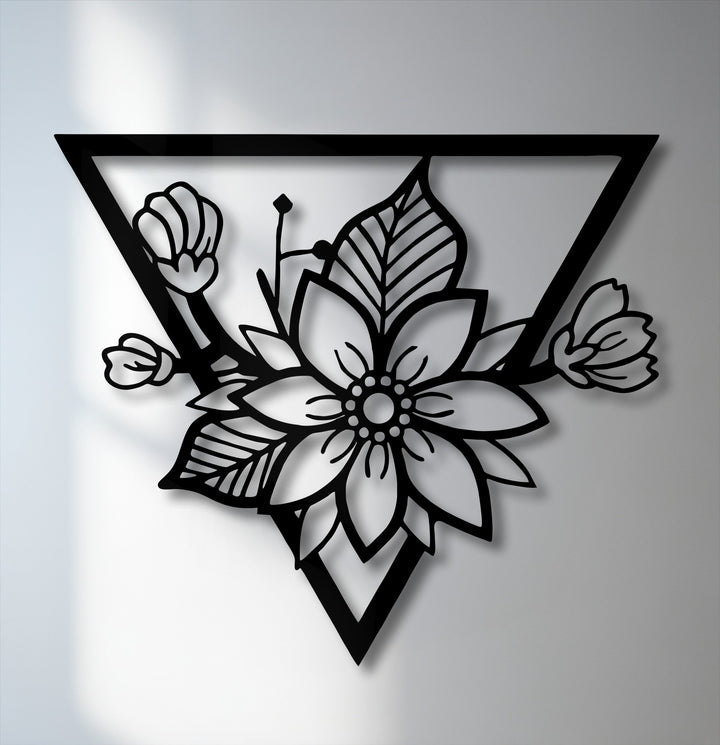 Vertically oriented decorative metal art features an intricate floral blossom design framed within a bold geometric triangle.