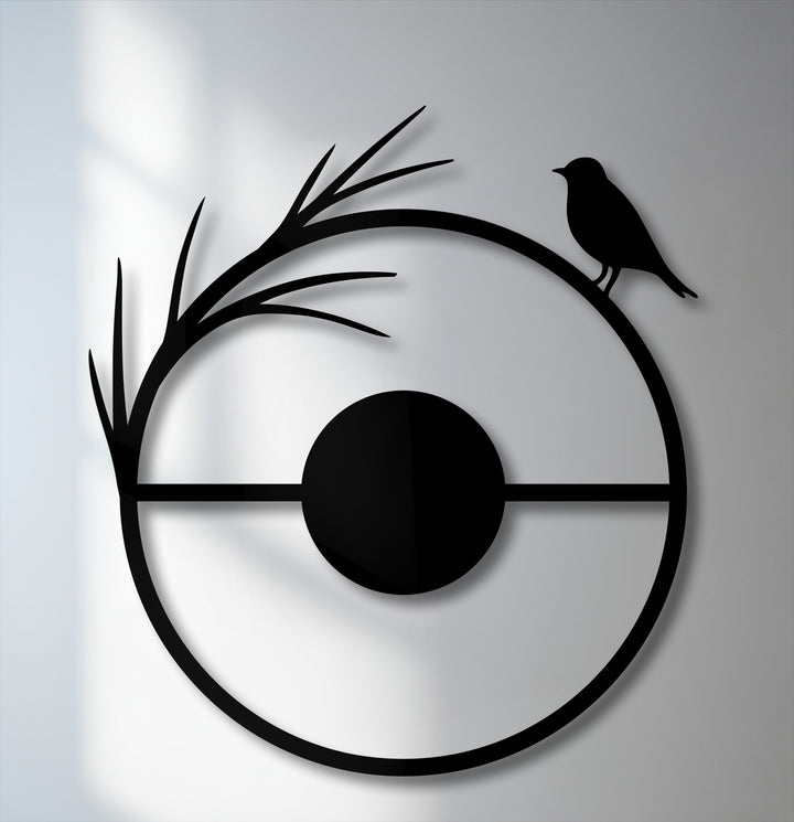 The smooth, matte black surface texture of the minimal bird metal artwork creates a modern nature silhouette.