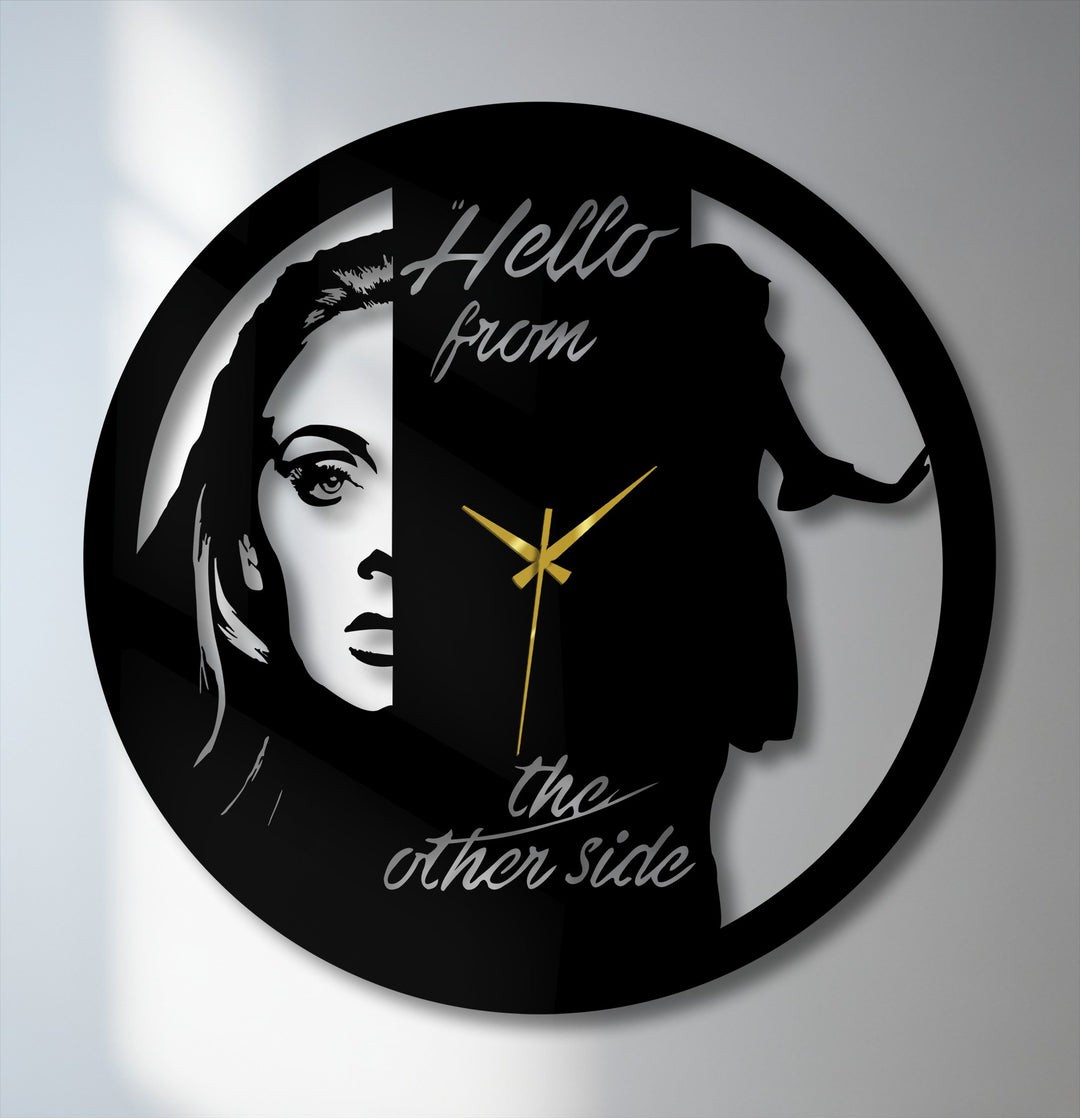Circular metal wall decor showcases an artistic portrait design of a dual face, combining silhouette and detailed art, with gold hands indicating the time's orientation.