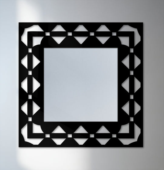 Brightest areas highlight the intricate, ornate geometry of this decorative patterned square framed wall mirror, a stunning piece of metal wall decor.