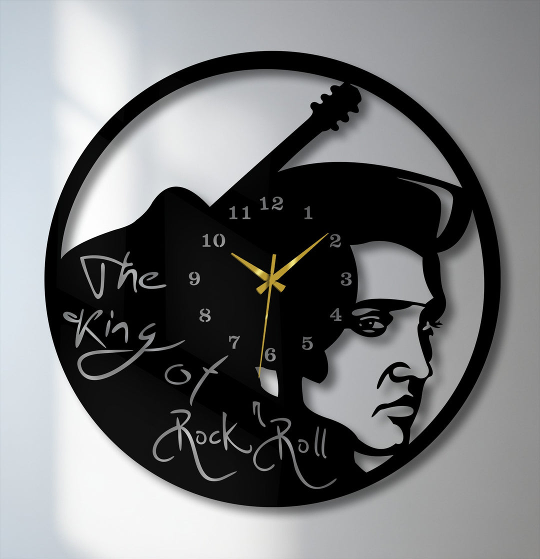 The brightest area showcases the luminous white wall behind the striking decorative metal art Rock Music Icon wall clock with its vintage guitar design.