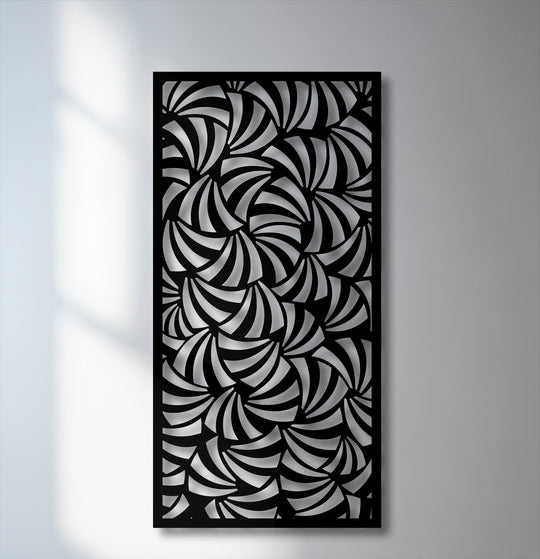 Interplay of dramatic light and shadow highlights the intricate spiral design of this modern geometric metal artwork panel.
