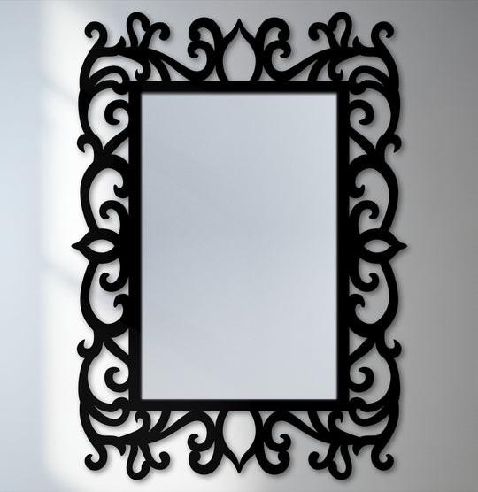 Negative space highlights the elegant black metal scroll detail around this ornate floral frame floor mirror, a statement piece for decorating with wall mirrors.