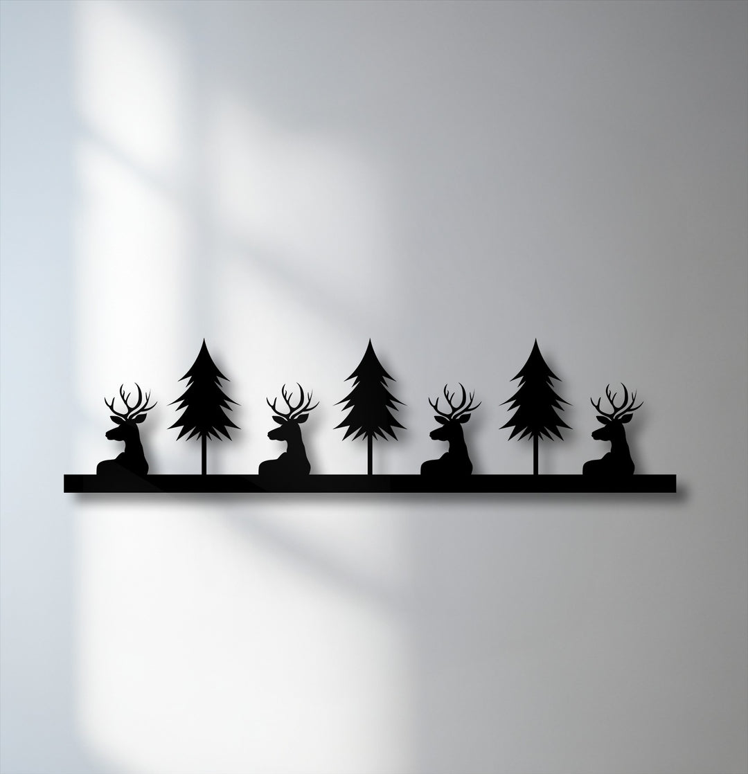 The brightest area reveals an illuminated wall, offering a stark contrast to the rustic deer and pine forest silhouette metal decoration wall art.
