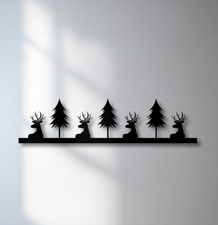 The brightest area reveals an illuminated wall, offering a stark contrast to the rustic deer and pine forest silhouette metal decoration wall art.