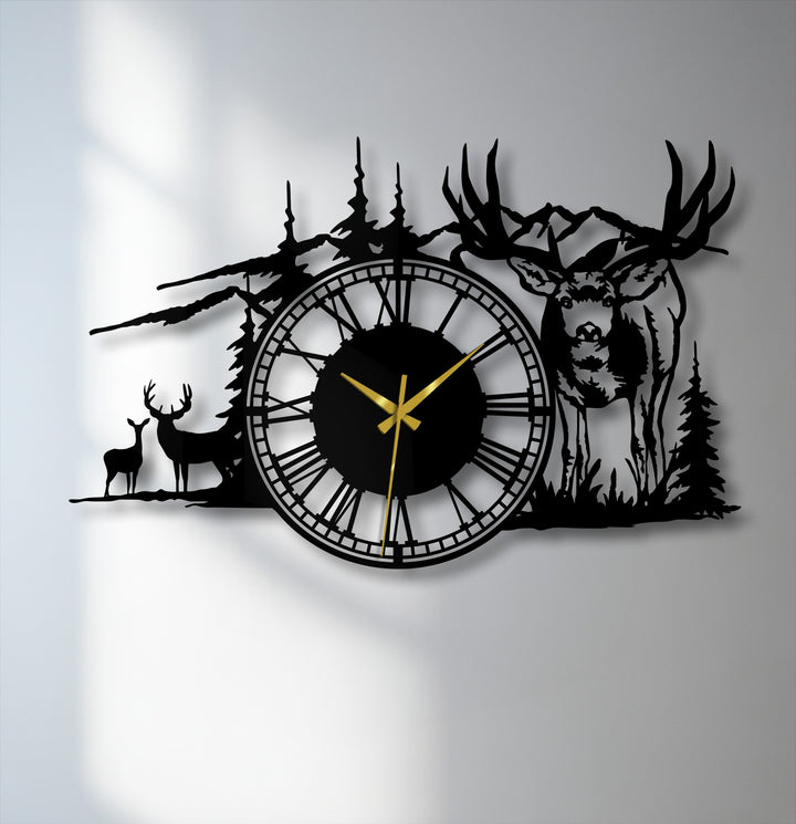 The stark color contrast of the black majestic deer forest metal artwork and its golden clock hands against the light wall creates a striking silhouette design.