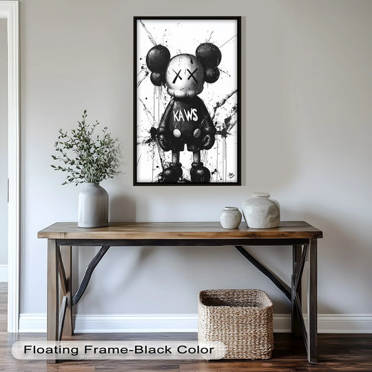 The darkest area of the KAWS graffiti oil painting art piece highlights the figure's expression, contrasting its monochrome palette on a wall above a wooden table.