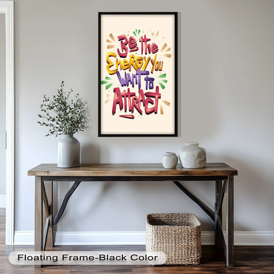 Displayed is the motivational oil painting art prints featuring 'Be the Energy You Want to Attract' in vivid colors, centrally positioned within a sleek black floating frame.