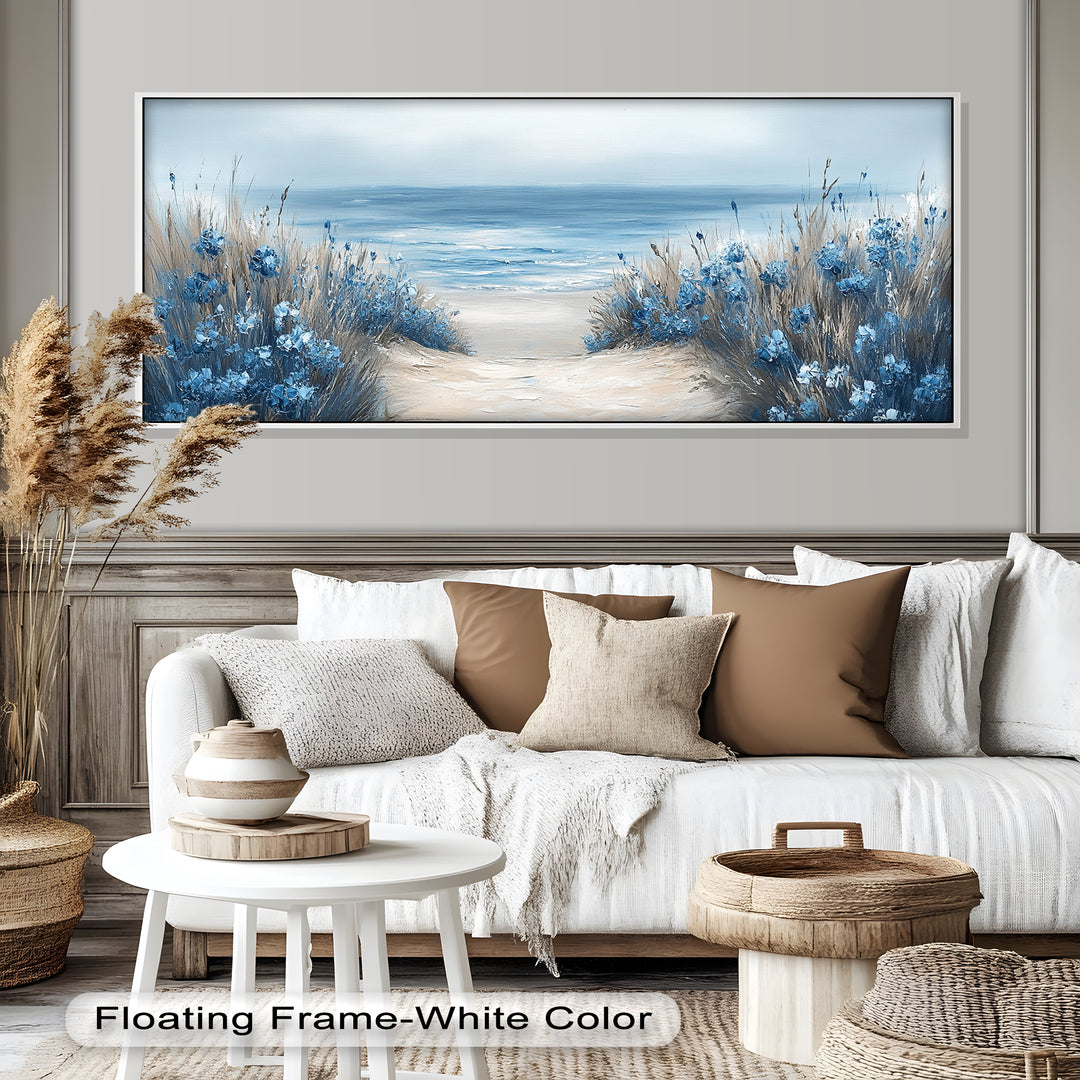 This serene coastal painting features a sandy path flanked by tall grasses and striking blue flowers, leading to a calm, misty ocean horizon.