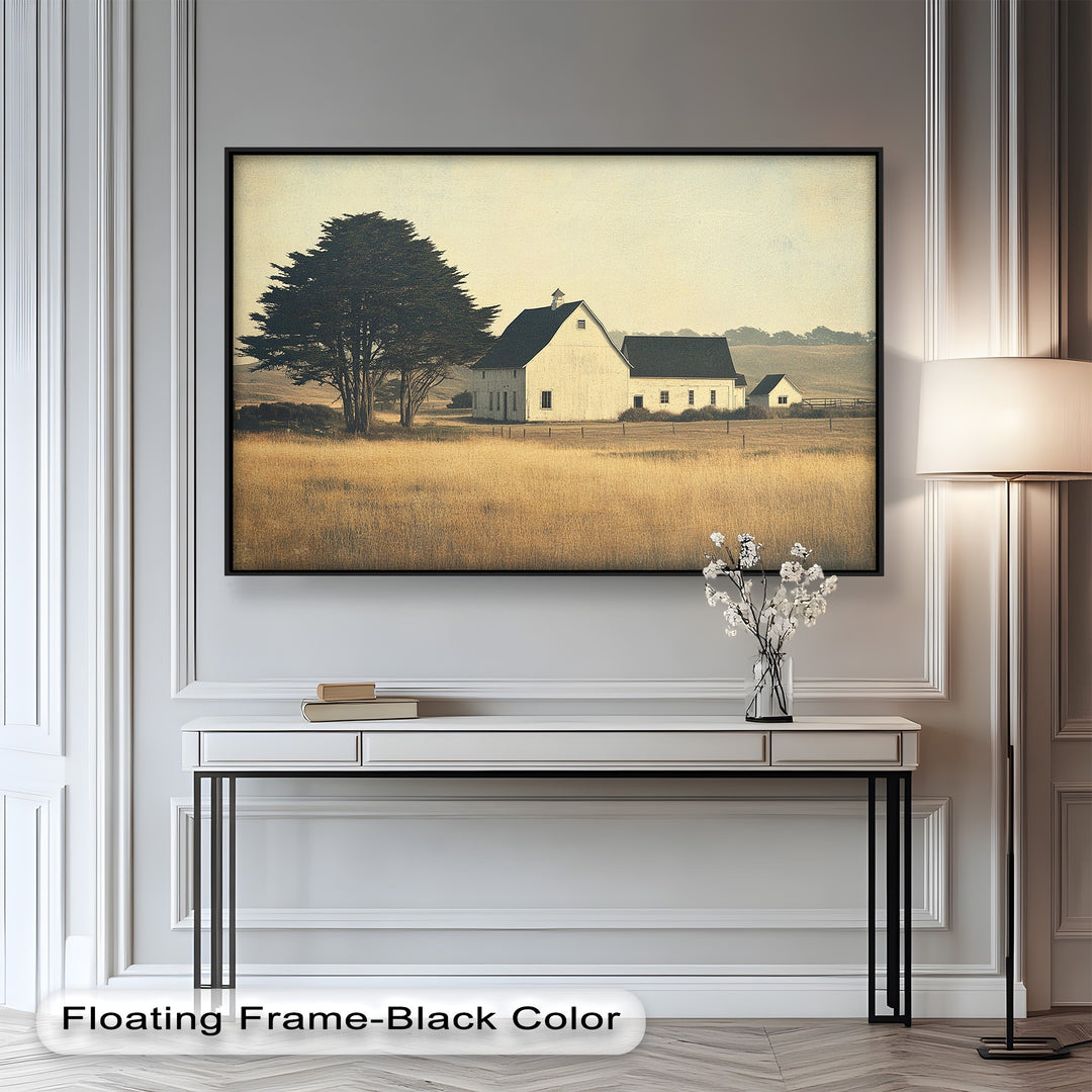 Golden field landscape with rustic white barn and lone trees.
