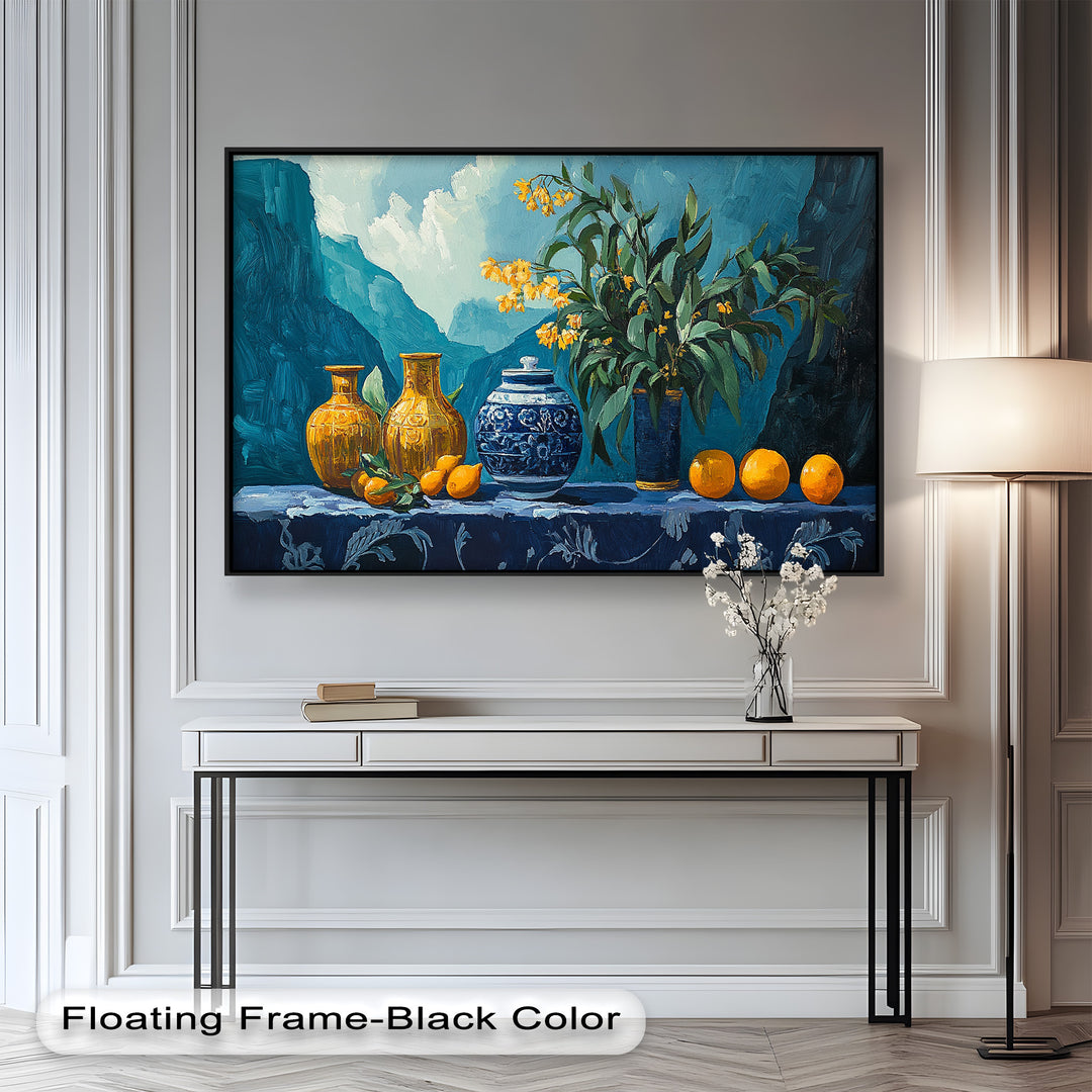 This vibrant still life painting features bold blue and yellow vases, fresh oranges, and delicate yellow flowers set against a majestic mountain backdrop.

