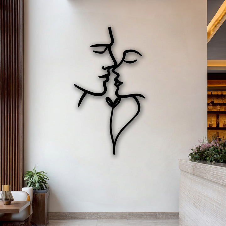 The negative space on the white wall accentuates the abstract faces of this elegant Unity Line decoration wall art, depicting a tender kiss.
