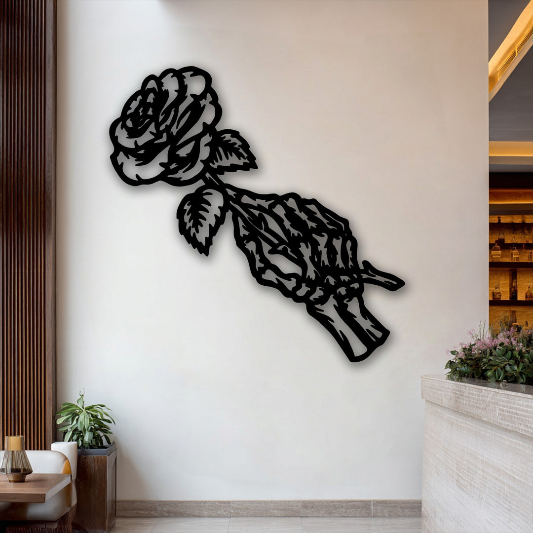 The stark black silhouette of the gothic fading rose skeleton metal art for wall creates a striking color contrast against the light wall.