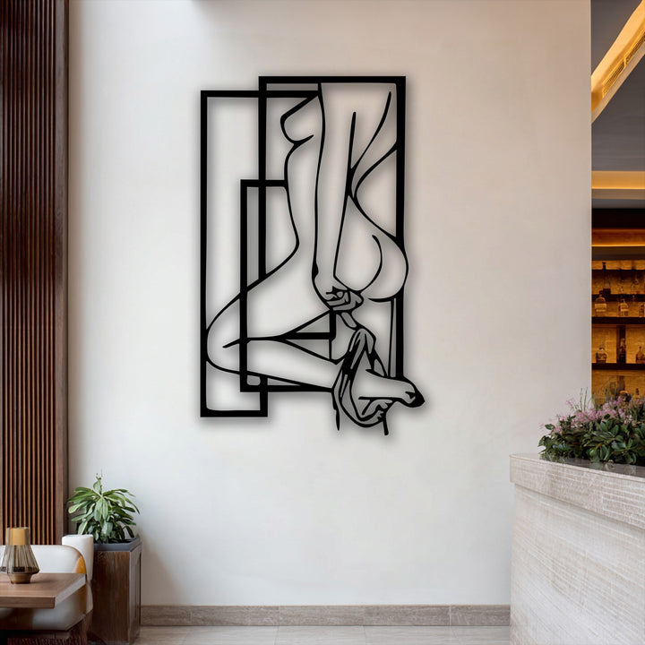 A vertically oriented abstract feminine silhouette metal decoration wall art features a nude figure outlined within modern geometric frames.