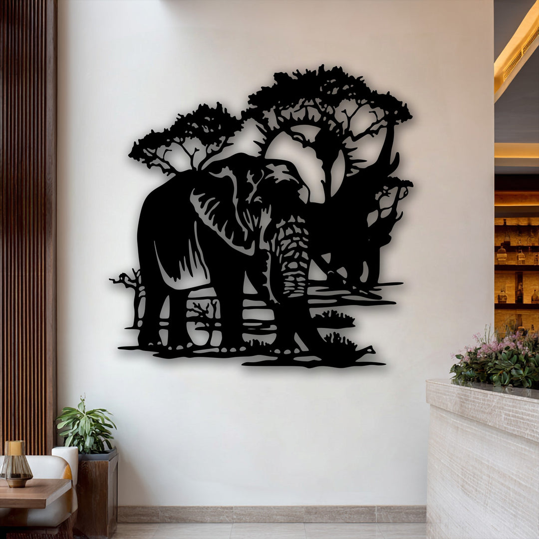 Creamy white wall displays striking black silhouette elephant landscape metal artwork under two trees.