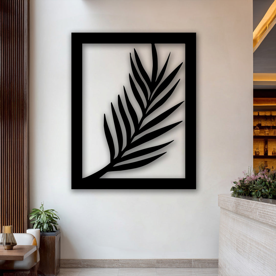 The darkest area showcases a bold black palm leaf silhouette, meticulously crafted as a piece of modern botanical metal art for wall.