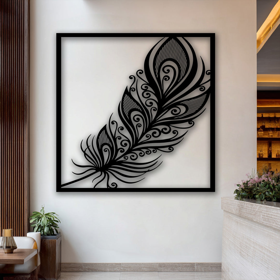 The matte black finish of this ornate feather decorative metal art creates a striking contrast on the wall.
