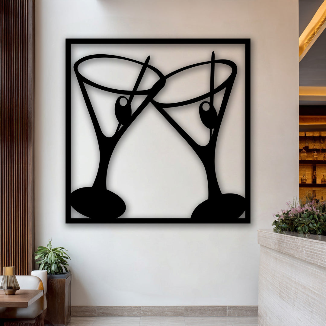 A rectangular unique metal wall art piece featuring two stylized modern bar cocktail glasses, black silhouettes clinking in a cheers gesture.