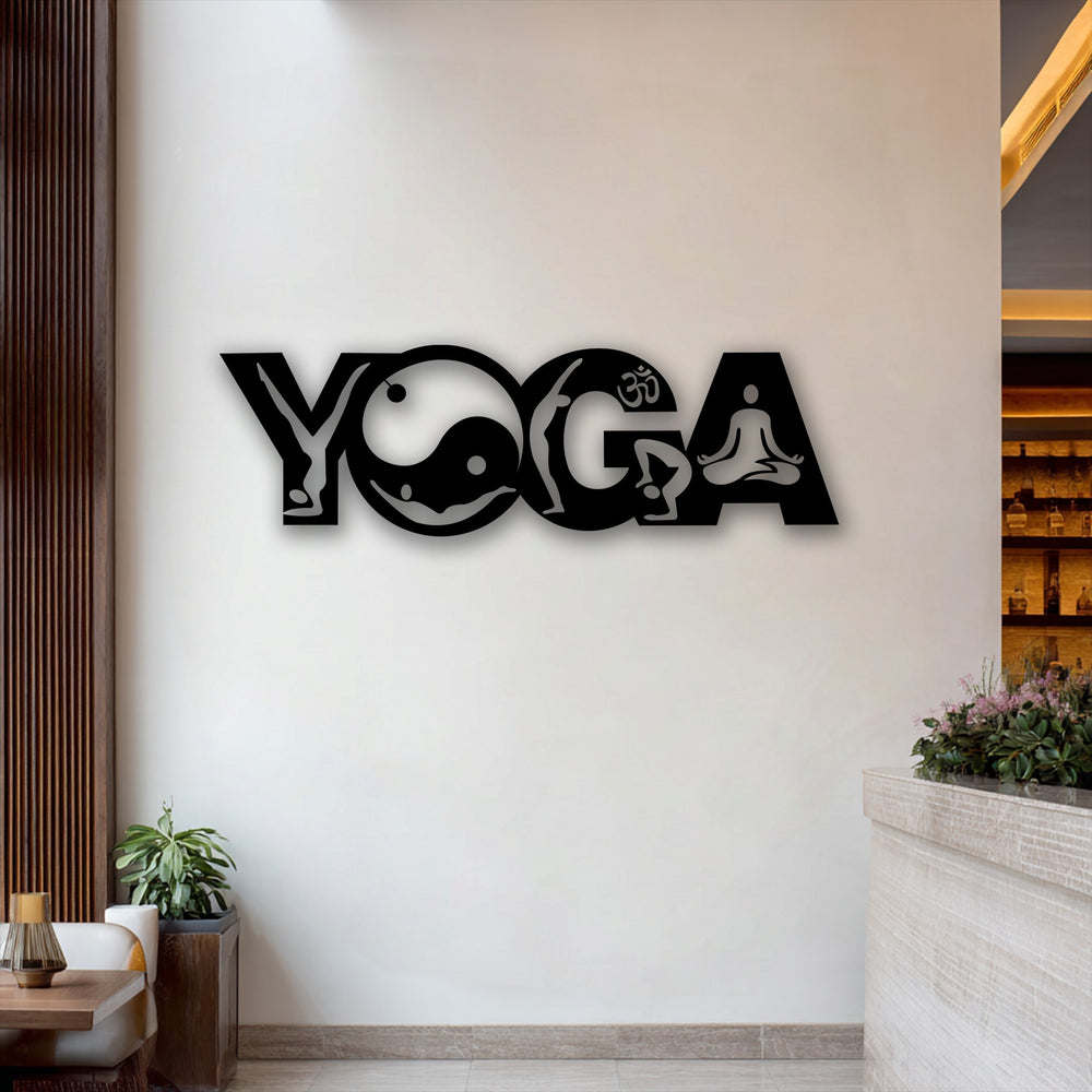 The sleek, matte black surface texture of the unique metal wall art depicting yoga poses contrasts smoothly with the crisp white wall.